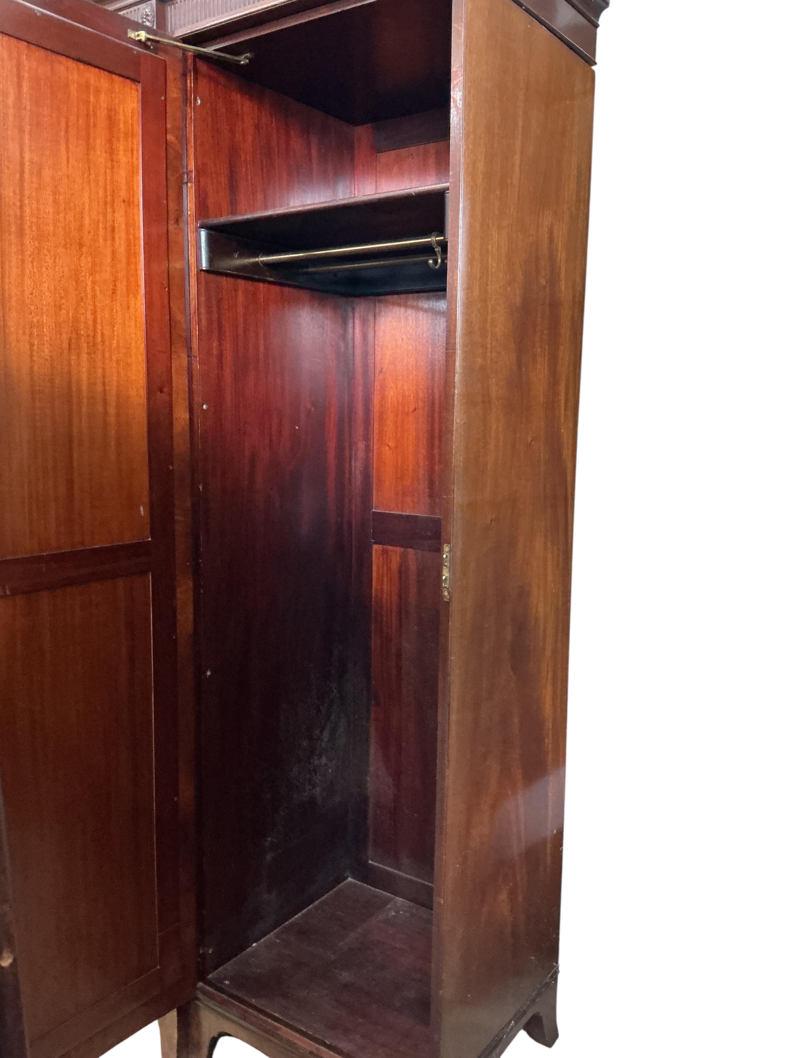 An early 20th century Heal & Son mahogany mirrored compactum wardrobe, width 224cm, depth 58cm, height 215cm
